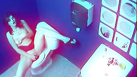 Smoking mistres yelly shows off her feet in the bathroom